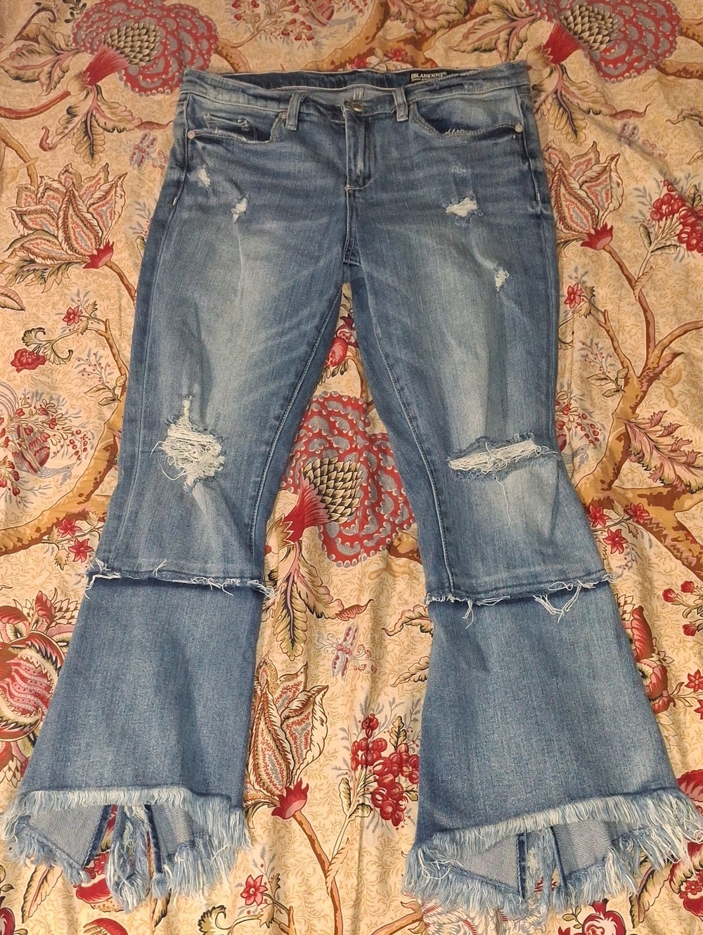 Blank NYC Light Blue Distressed Flare Jeans with Frayed Hem